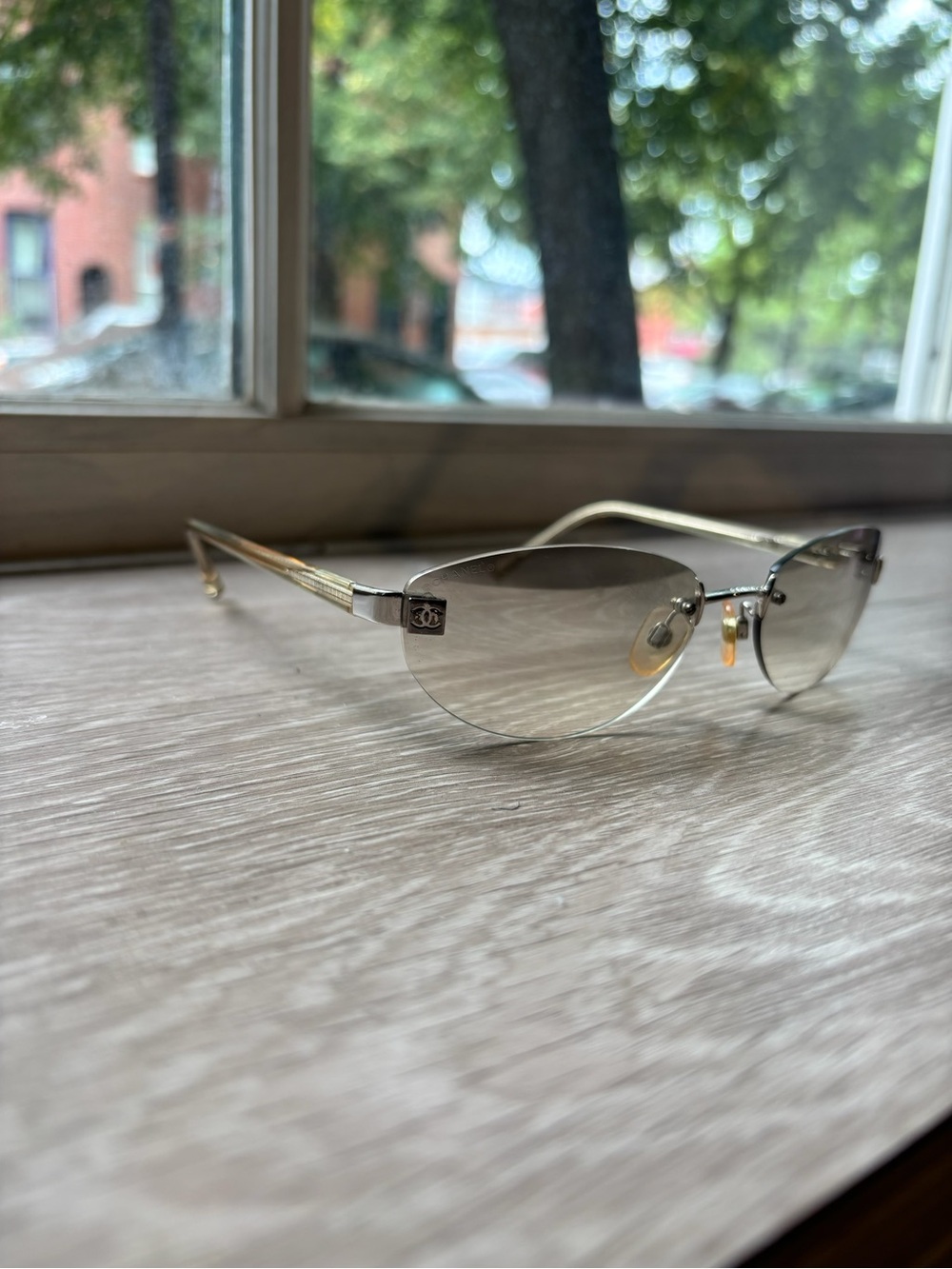 CHANEL Rimless Gradient Sunglasses in Gold and Gray